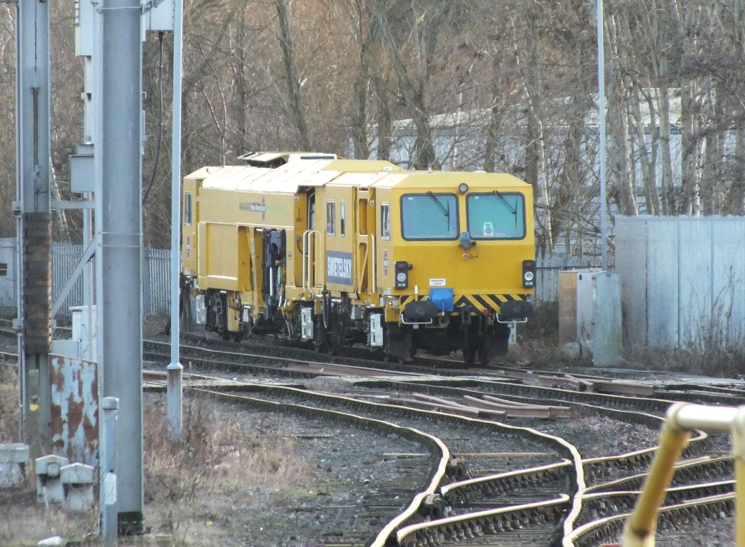 Whistlestopper on Train Siding: Swietelsky Babcock Rail Tamper No. #DR73940 stabled in Carlisle High Wapping Sidings on Thursday 21st December 2023.