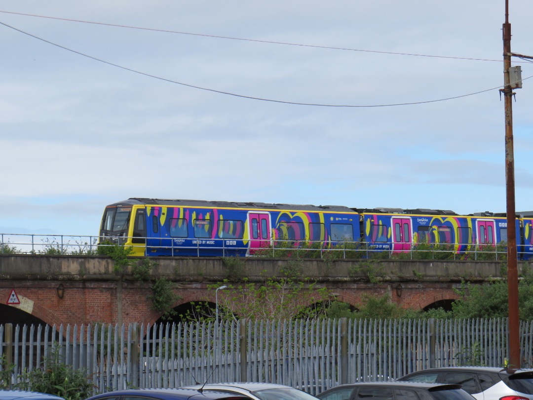 Ross McCall on Train Siding: 777013 on the viaduct just before the descent towards Moorfields showcasing its Eurovision wrap livery.