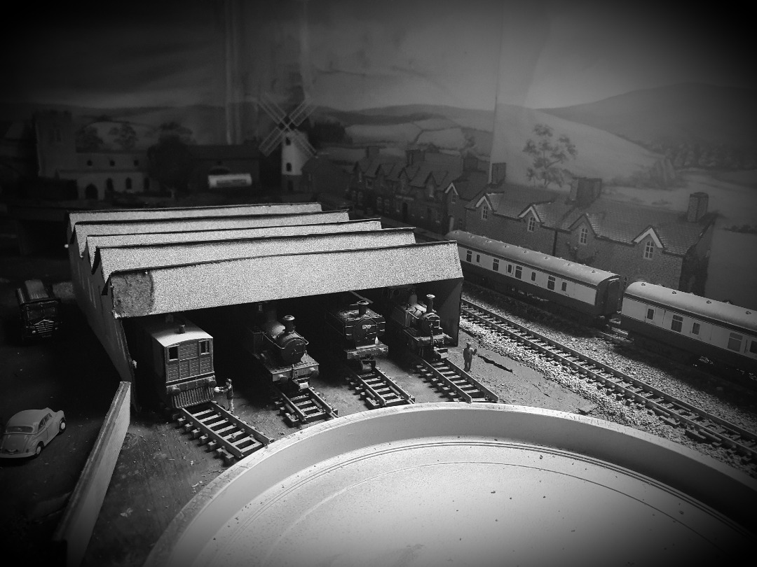 Locomotive Lloyd on Train Siding: The kitbashed engine shed at Biggsfordshire Central, still needs some detailing and roof slates. Still stops any leaks on the
line-up...