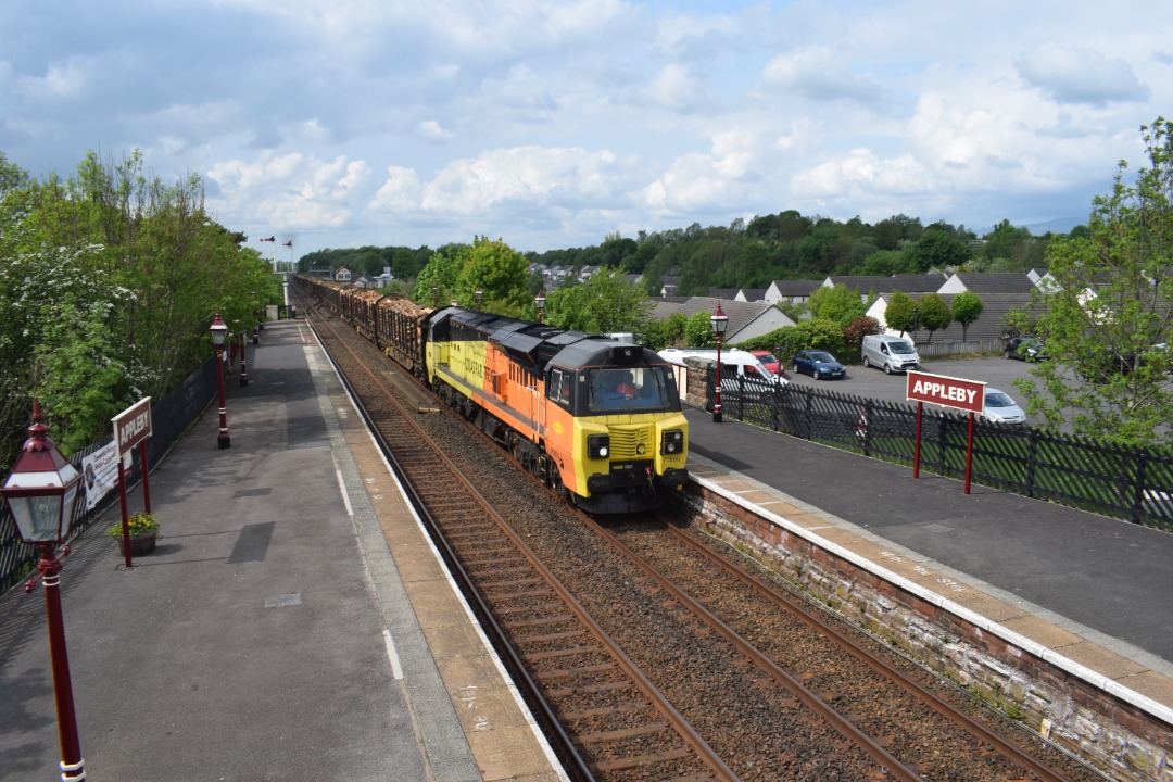 Hardley Distant on Train Siding: CURRENT: 70806 passes Appleby Station today with the 6J37 12:52 Carlisle Yard to Chirk Kronospan Logs service.