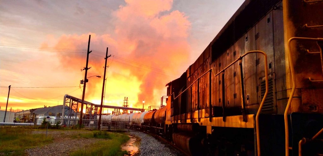 Michael H. Massey on Train Siding: On a humid summer evening the sun sets behind the cooler fans of the Eldorado Chemical LSB plant in Eldorado Arkansas USA
with GMD...