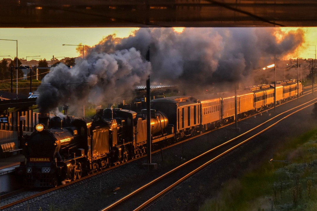 Shawn Stutsel on Train Siding: Dark Smoke, an Orange Glow on Steamrail's K100 and K183, along with T395 on the rear as they pass through Williams Landing,
Melbourne...
