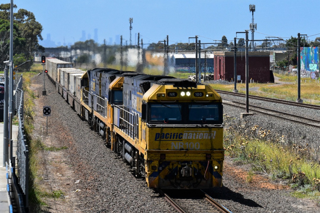 Shawn Stutsel on Train Siding: Pacific National's NR100, NR26(IP Livery) and NR15, race through Williams Landing, Melbourne with 6MP4, Intermodal Service,
bound for...
