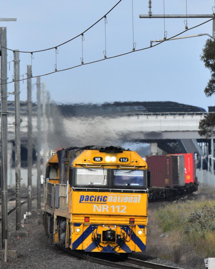 Shawn Stutsel on Train Siding: Pacific National's, NR112, and NR108 rolls past Aircraft Station, Melbourne with 7AM5, Intermodal Service ex Adelaide.