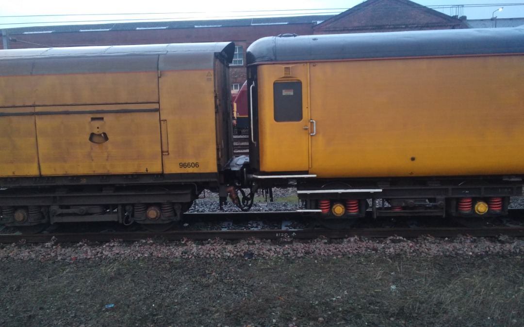 kieran harrod on Train Siding: Who's hiding between the network rail departmental testing coaches at doncaster station, it's EWS 67016.