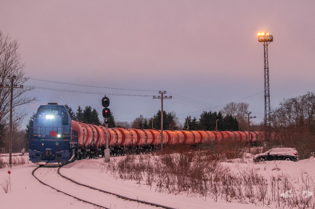 Adam L. on Train Siding: A former C30-7A, now an C30-M nicknamed "Otto" owned by Operail, is seen departing the Kohtla-Nõmme Interchange Yard
with a long string of...