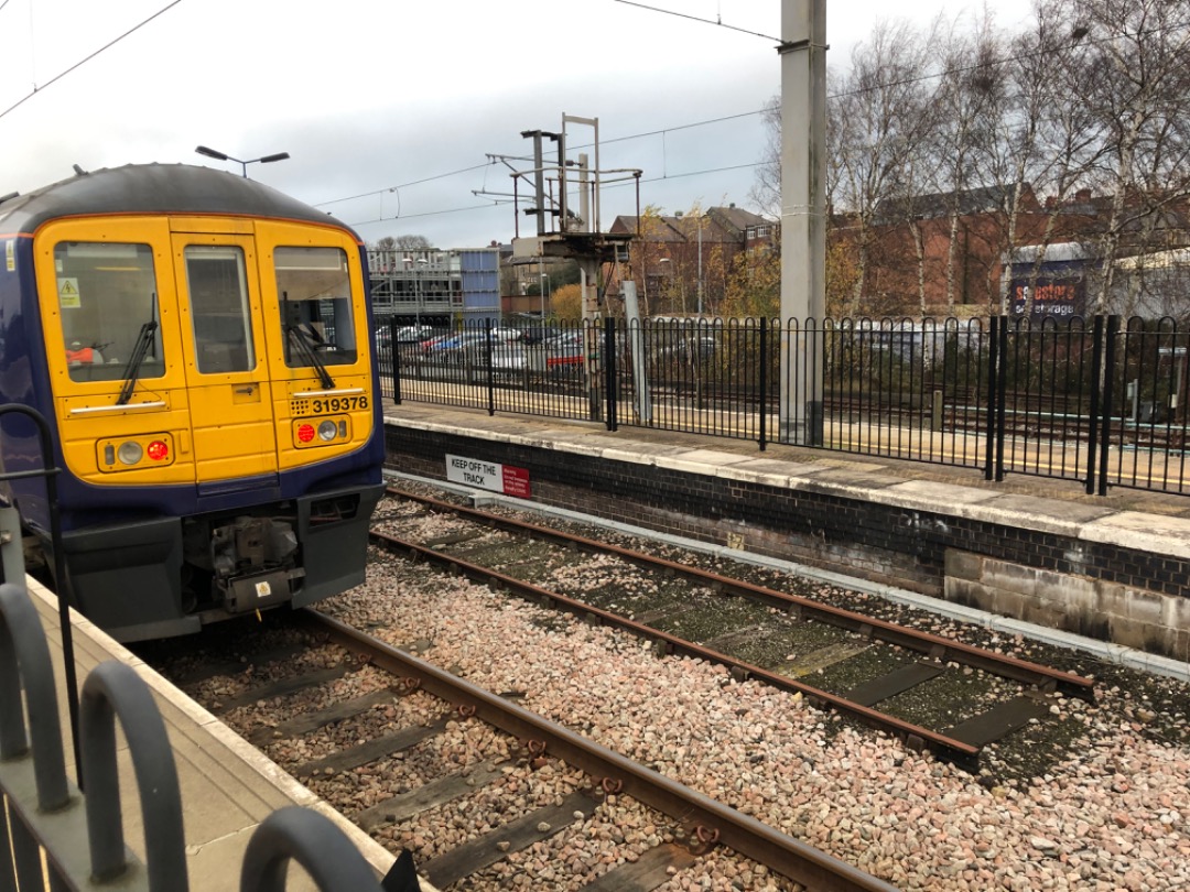 k unsworth on Train Siding: British Rail Class 319 , 319 378 stands at the slightly "skew whiff" looking buffers at platform 3 , next to the severed
platform 2 Wigan...