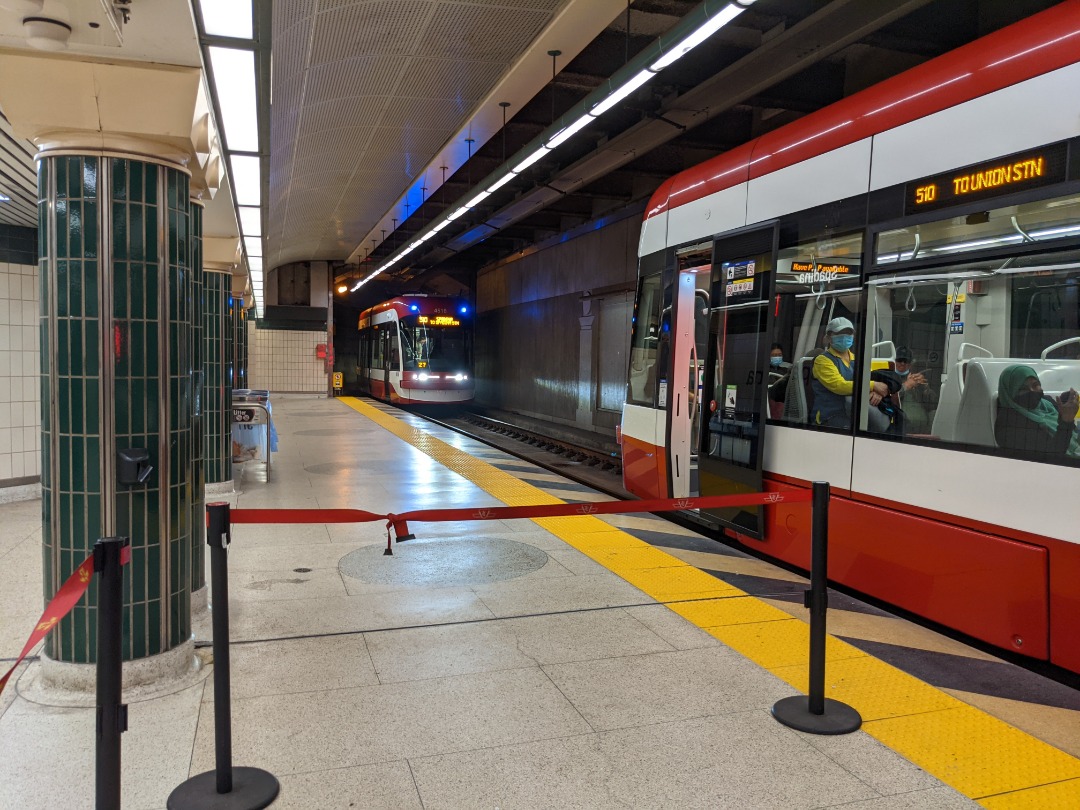 Ryan on Train Siding: A southbound 510 streetcar waiting to depart from Spadina Station, as well as a northbound 510 arriving.
