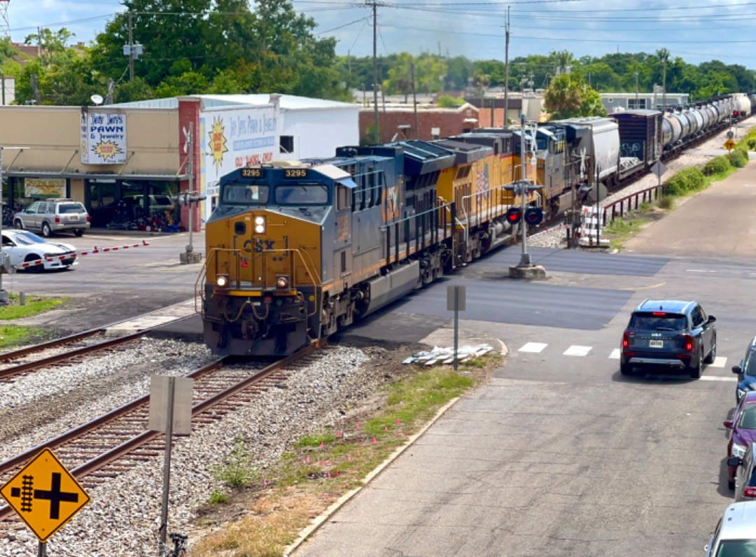 Christopher Jones on Train Siding: An CSX New Orleans bound freight passes through downtown Gulfport with some UP power sandwiched inbetween.