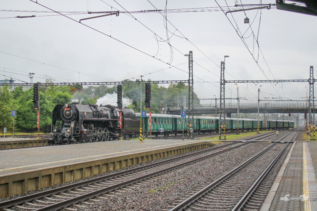 Adam L. on Train Siding: An ČSD 475 Class Tender Engine with an delayed retro passenger train from Ostrava Svinov arrives into Bohumín with 20mins on
its back after...