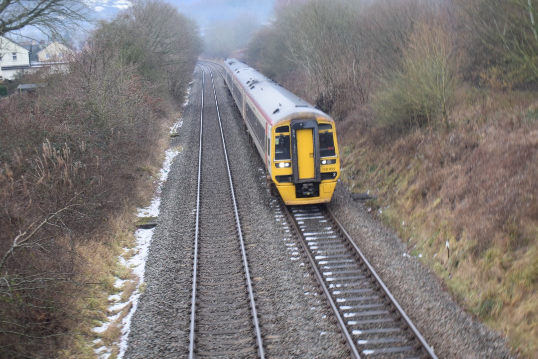 Hardley Distant on Train Siding: CURRENT: 158822 (Leading) and 158841 (Rear) pass Rhosymedre near Ruabon today with the 1D12 09:08 Birmingham International to
Holyhead...