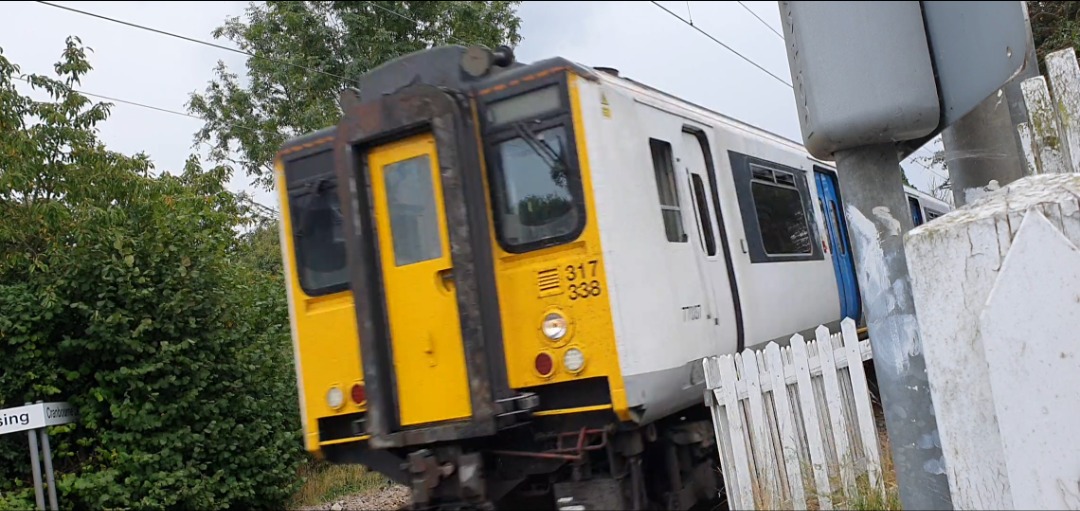 Jacob on Train Siding: #317348 ex Great Northern leads an 8 car Greater Anglia service to Hertford East past Cranboune LC