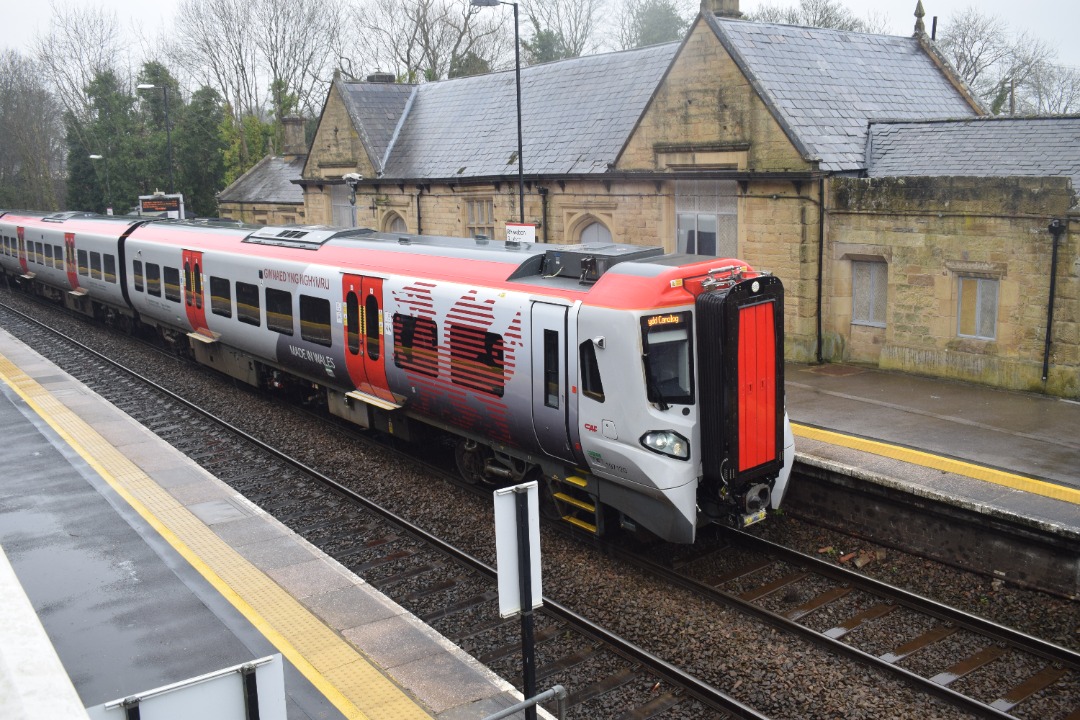 Hardley Distant on Train Siding: CURRENT: 197120 sporting an alternative Transport for Wales livery with a Red Dragon design, calls at Ruabon Station today with
the...