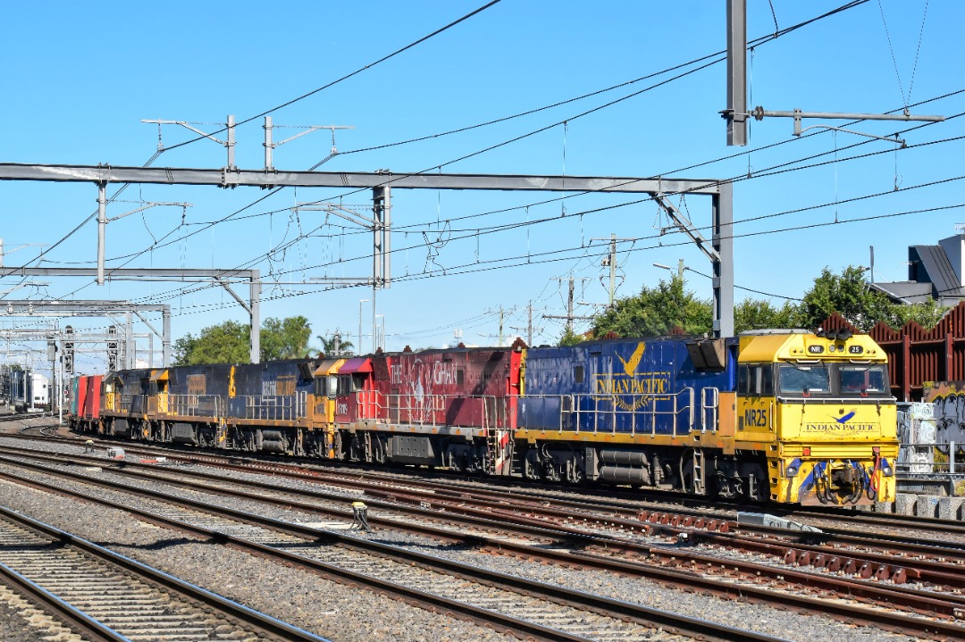 Shawn Stutsel on Train Siding: Pacific National's NR25 (Indian Pacific), NR109 (Ghan), NR85, NR52 (R U OK) and 9322 trundles downgrade towards Footscray,
Melbourne...