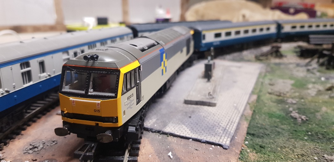 Wits Main & Branchline on Train Siding: Class 60 No. 60015 'Bow Fell' is seen taking a break to refuel at Ivy TMD. Louie the trainspotter is very
pleased as the shot...