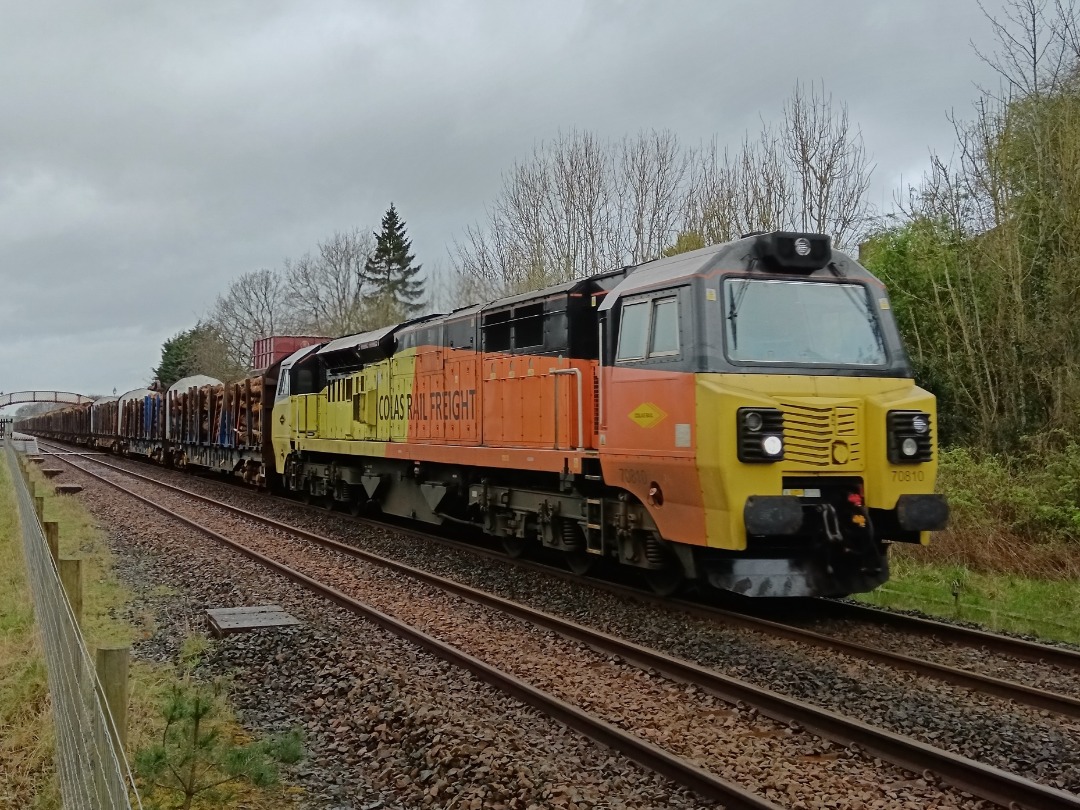 Cumbrian Trainspotter on Train Siding: Colas Rail class 70/8 No. #70810 passing Appleby this afternoon working 6J37 1252 Carlisle Yard to Chirk Kronospan with
the logs.