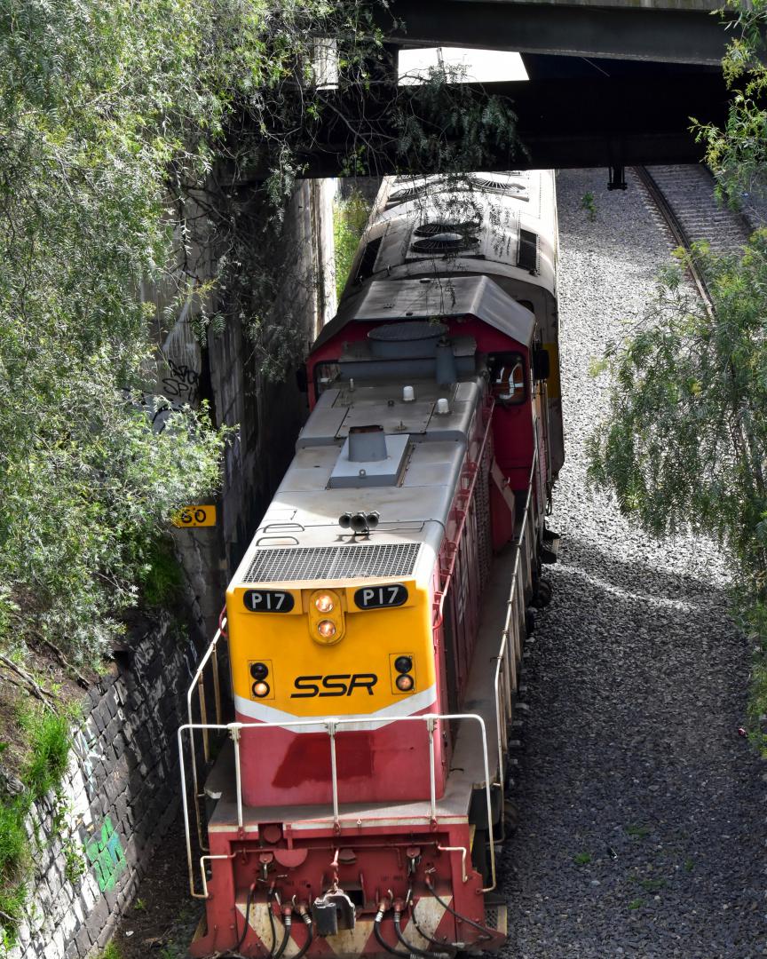 Shawn Stutsel on Train Siding: SSR's P17(Long End Leading) and S317 dive underneath Footscray Station, Melbourne with 9594, Loaded Grain Wagon transfer
from Tottenham...