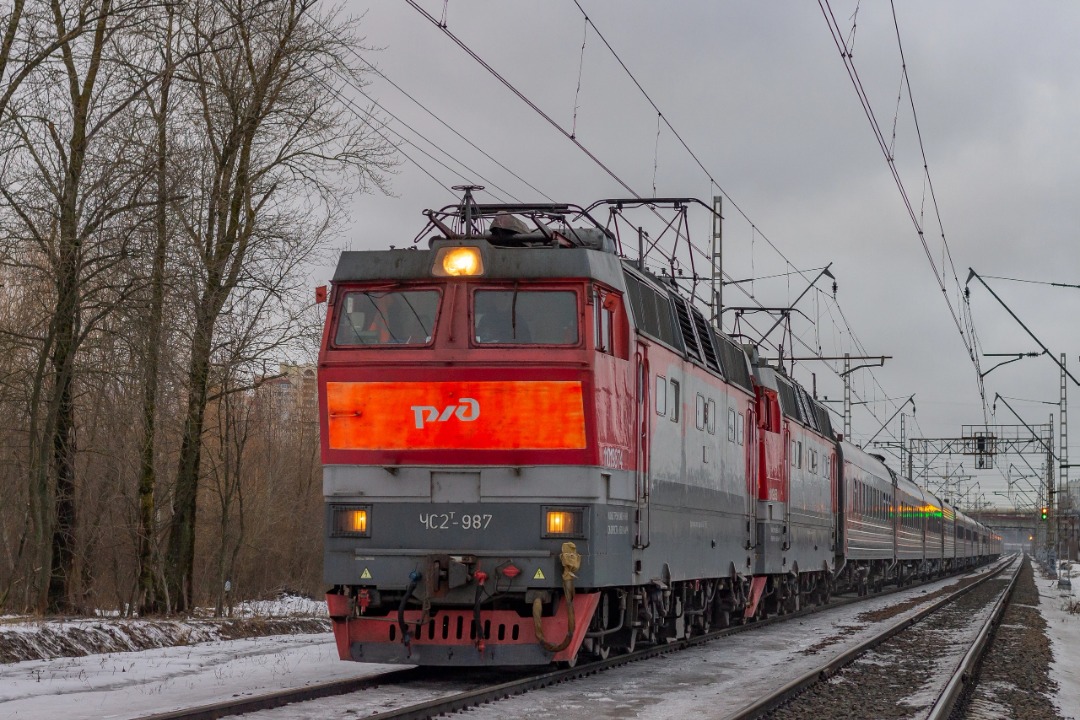 Vladislav on Train Siding: CHS2T-987 electric locomotive with a passenger train and another CHS2T being driven on the Dolgorukov's Dacha (Ladoga railway
station) -...