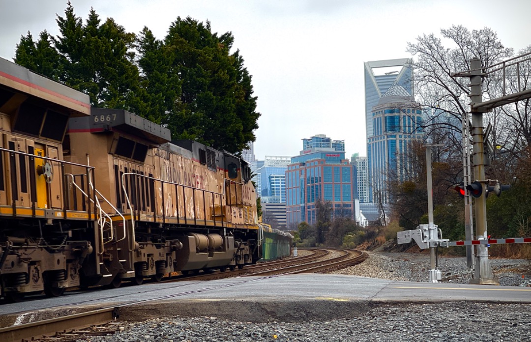 Christopher Jones on Train Siding: Some unique western power makes its way across Summit Avenue into downtown Charlotte, NC. Despite being overcast, it was
still a...