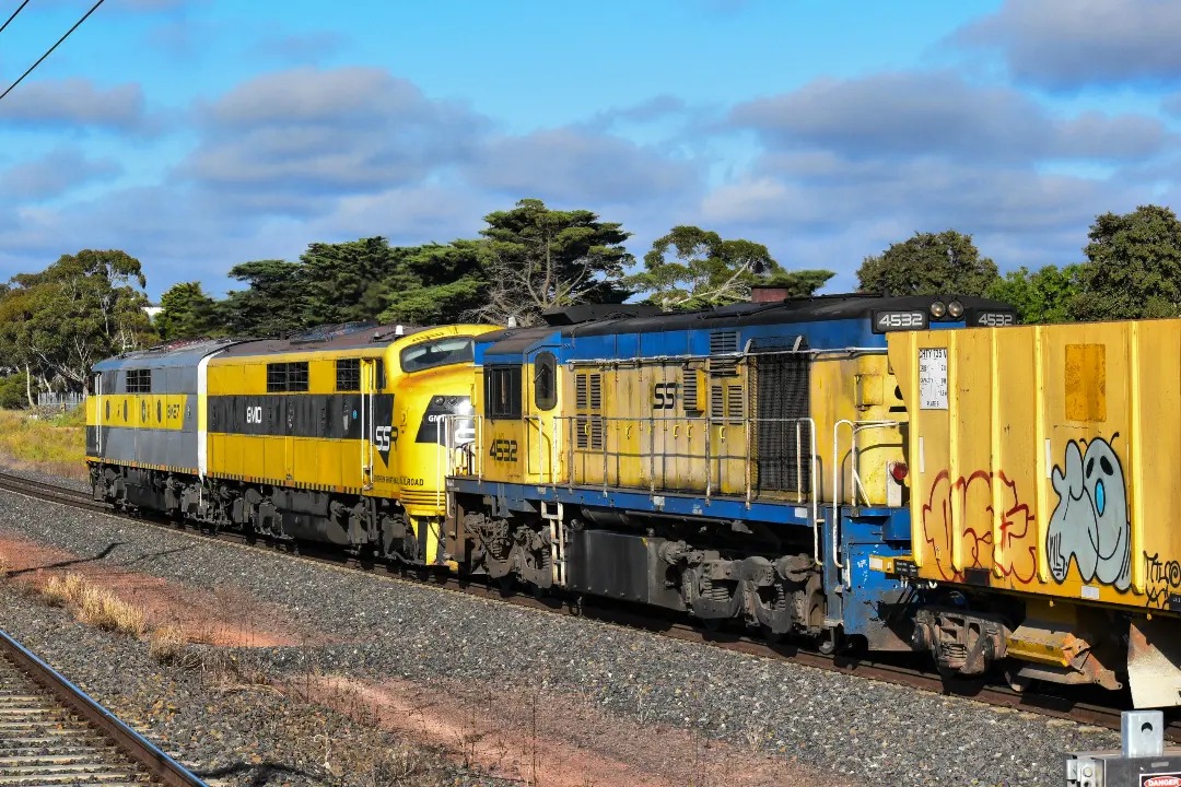 Shawn Stutsel on Train Siding: SSR's GM27, GM10, and 4532 crawl past Aircraft Station Melbourne with 6M42v, ARTC Maintenance Service, where they were
dropping Ballast,...