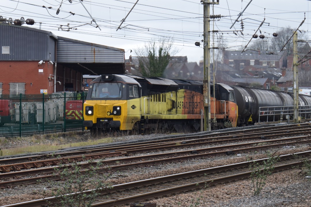 Hardley Distant on Train Siding: CURRENT: 70804 (Both Photos) works up the incline and onto the West Coast Main Line adjacent to Preston Station today working
the 6E44...