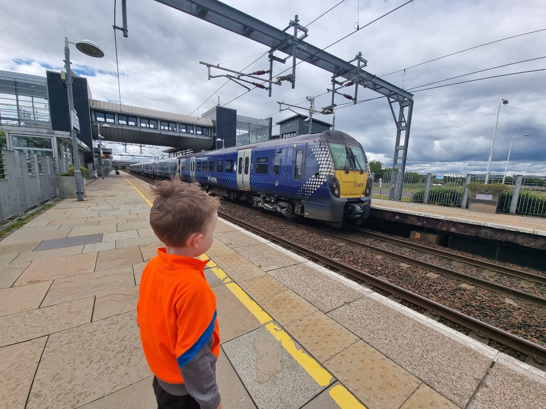 Glenn McGuire on Train Siding: My 4 year old trainspotter watching his favourite train pulling into Edinburgh Park Station.