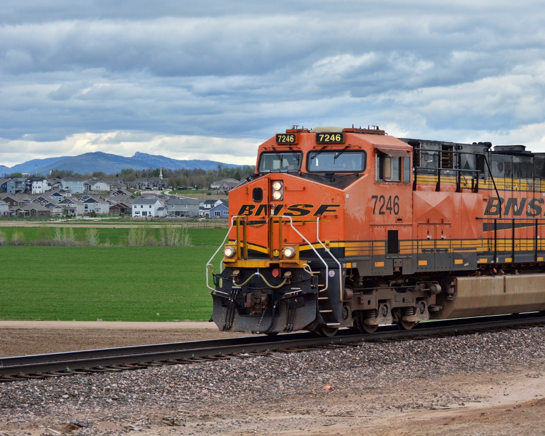 quirkphotoandmedia on Train Siding: BNSF southbound freight rolls through farmland just south of Berthoud, CO. The main BNSF line running north to south
through...