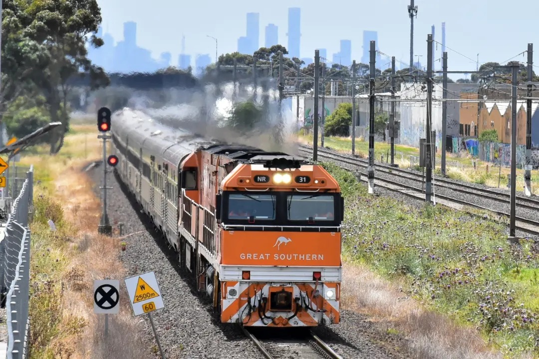 Shawn Stutsel on Train Siding: The Journey Beyond's, The Great Southern Heads through Williams Landing, Melbourne heading west back to Adelaide as 2TA8,
behind NR31...