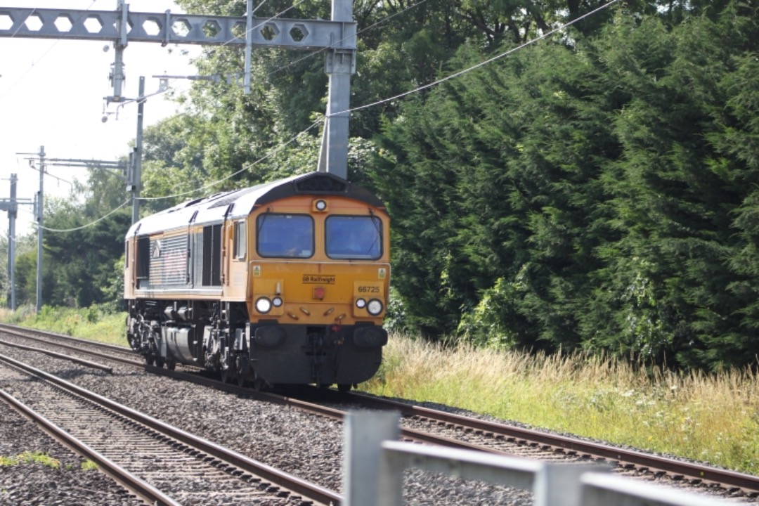 Michael W on Train Siding: GBRF class 66 'Shed' No. 66725 working light loco past Steventon LCs on 0V44 Eastleigh East Yard to Bicester MOD GBRF.
(19/07/2021).