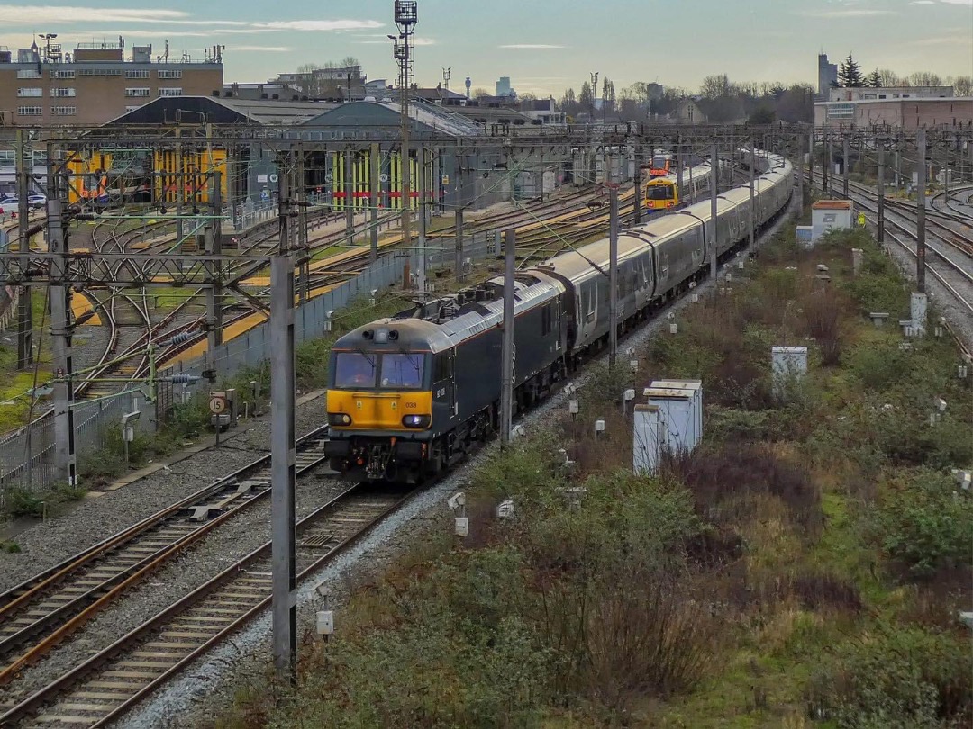 Inter City Railway Society on Train Siding: Class 92038 t&t 92018 are seen passing Willesden TMD working 3M16 London Euston to Wembley Intercity Depot.
