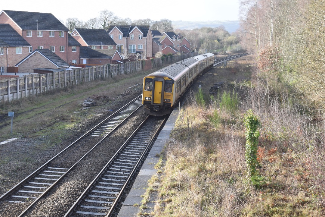 Hardley Distant on Train Siding: CURRENT: 150283 (Leading) and 158837 (Rear) call at Ruabon Station today with the 1D12 09:08 Birmingham International to
Holyhead...