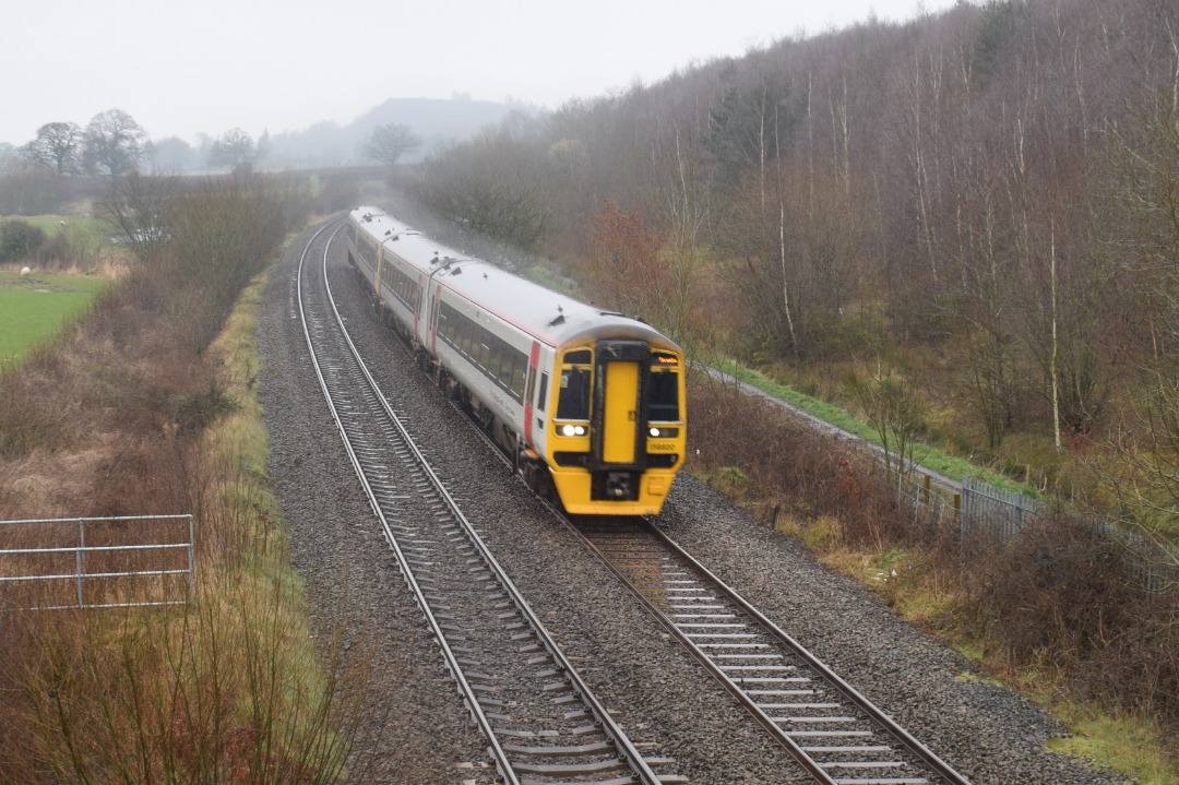 Hardley Distant on Train Siding: CURRENT: 158820 (Front - 1st Photo) and 158824 (Rear - 2nd Photo) pass Bonc yr Hafod Country Park between Ruabon and Wrexham
today...