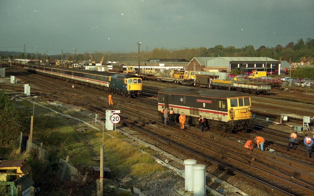 Inter City Railway Society on Train Siding: 33114 cautiously a[[roaches off-the-rails 73205 at Eastleigh in 1994. The 73 carries the front-end modification for
running...