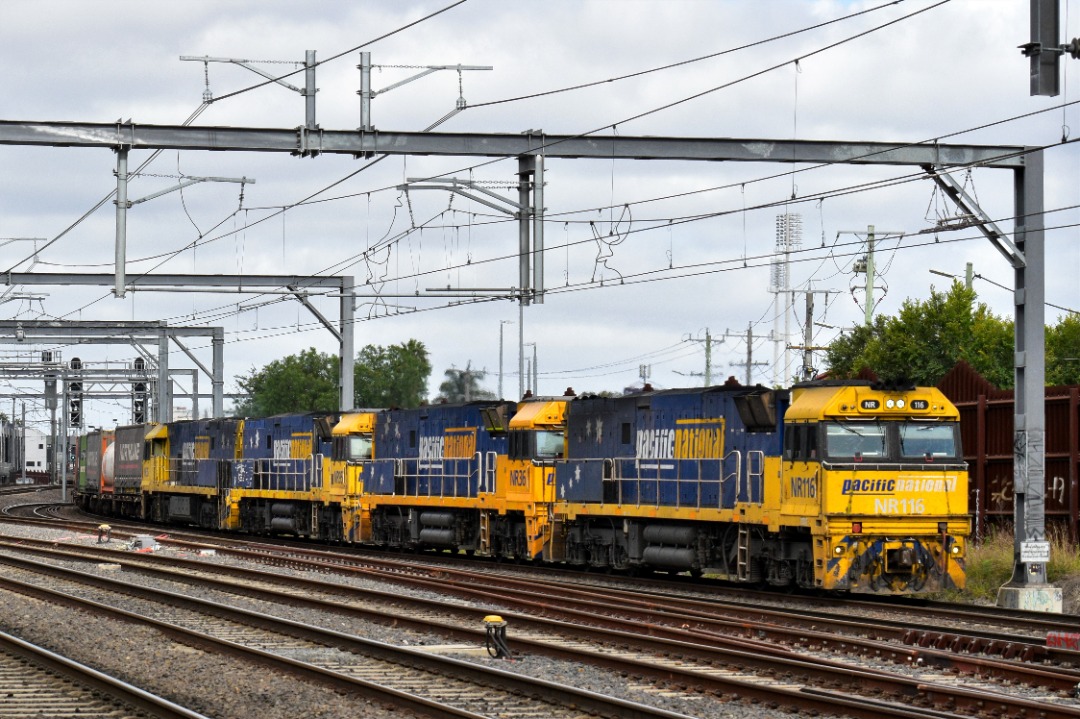 Shawn Stutsel on Train Siding: Pacific National's NR116, NR36, NR95, and NR35 rounds the corner and down towards the Bunbury Street Tunnel, Footscray
Melbourne with...