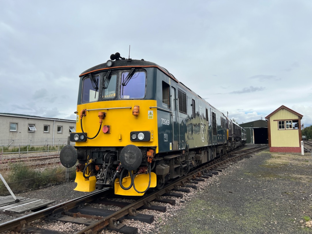 GBLokführer on Train Siding: Another 1st for a class 73/9 73969 stands outside the Strathspey Railways carriage shed with an errant 66743 behind it.