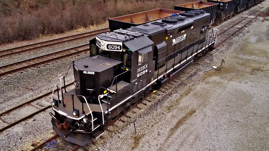 Randall Meadows on Train Siding: HZRX 6094 at Alliance Ohio. I decided to test out my drone to get the SD40-2 that loads rock into the hopper cars seen in the
backround.