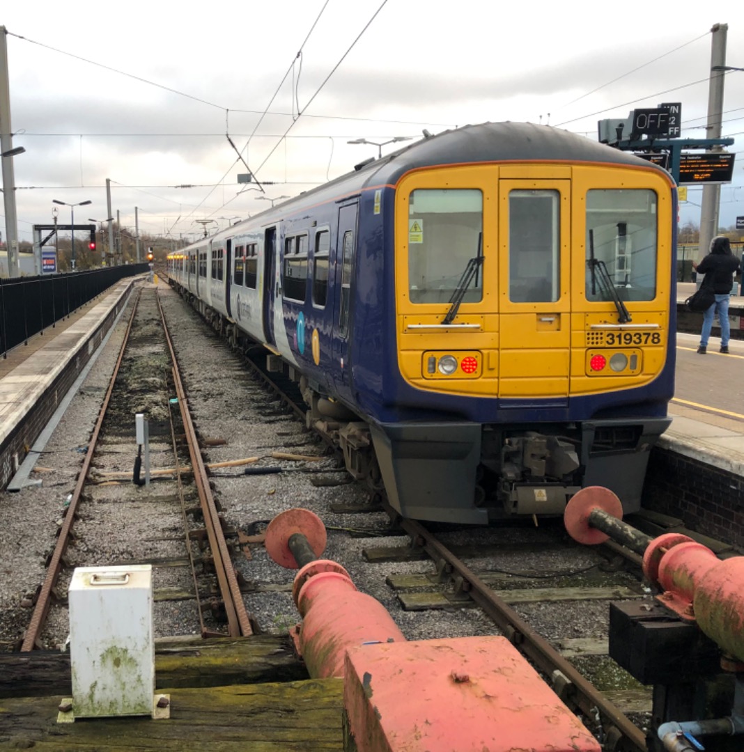 k unsworth on Train Siding: British Rail Class 319 , 319 378 stands at the slightly "skew whiff" looking buffers at platform 3 , next to the severed
platform 2 Wigan...