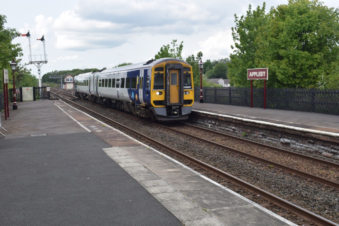 Hardley Distant on Train Siding: CURRENT: 158867 calls at Appleby Station today with the 2H93 14:50 Carlisle to Leeds (Northern) service.