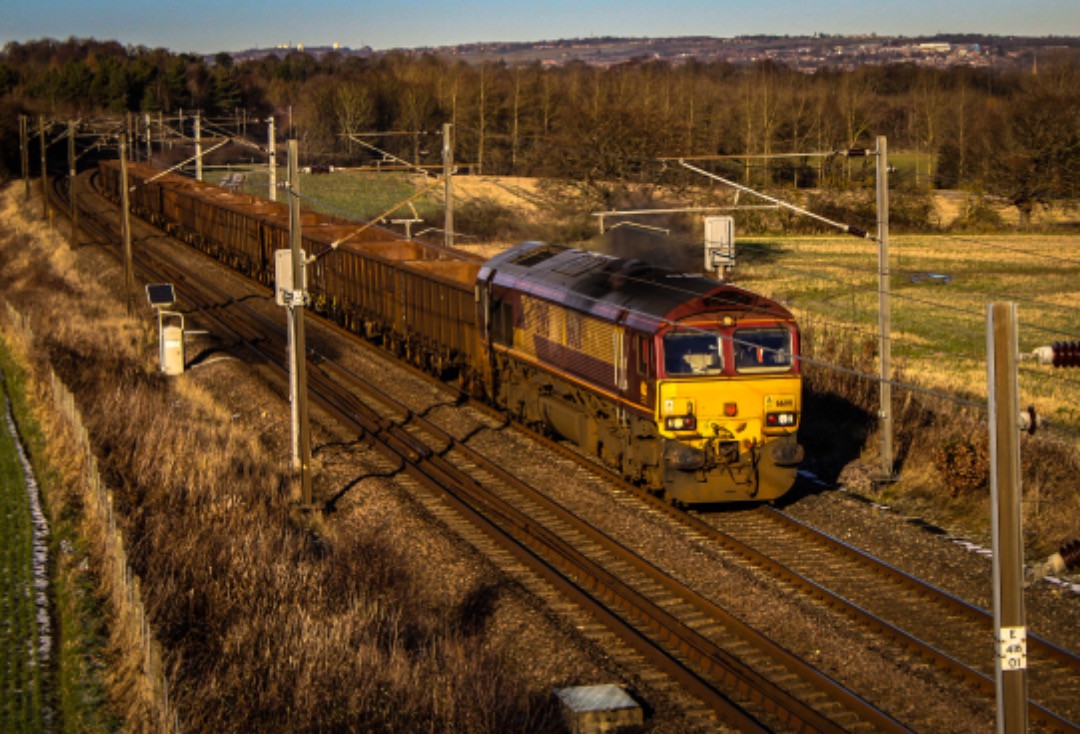 Rowan on Train Siding: 66011 is seen passing Plawsworth working 6E97 10:18 Carlisle N.Y. to Tees Dock Bsc Export Berth (16/01/23)
