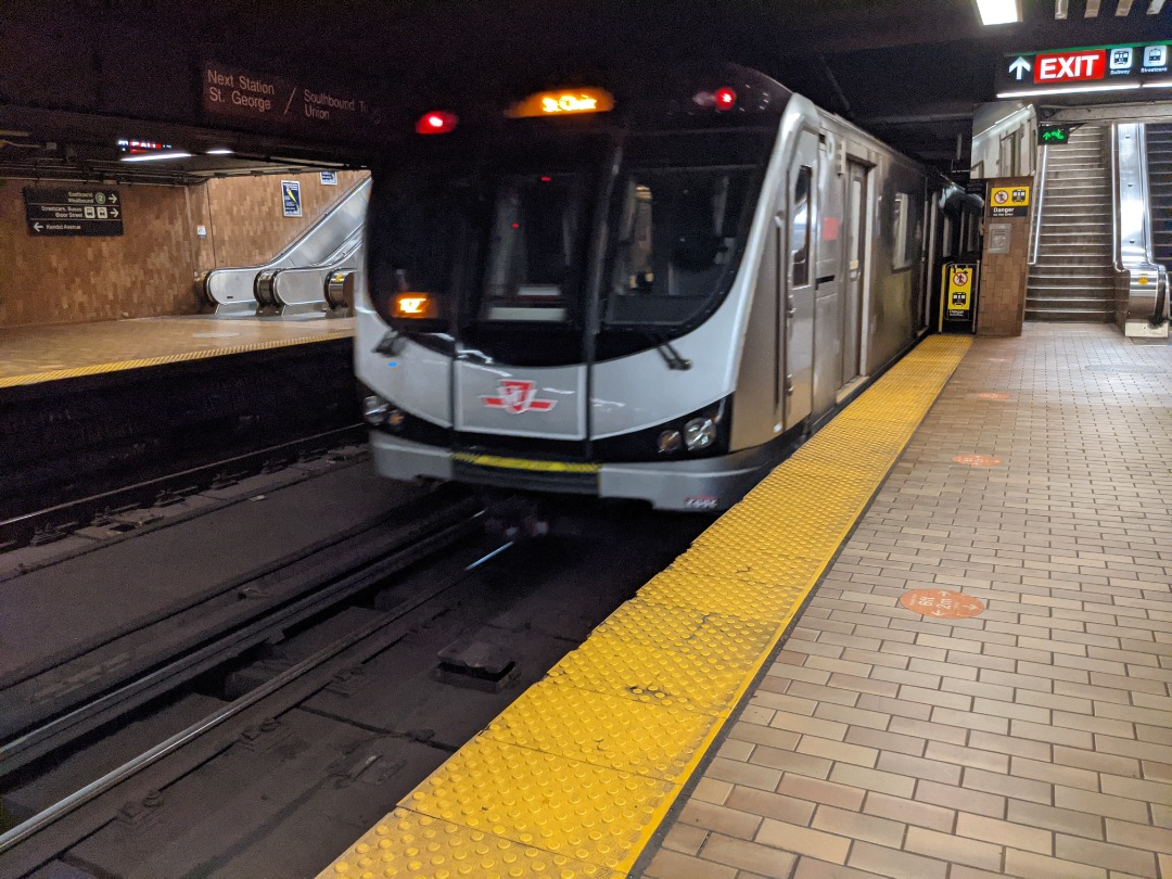 Ryan on Train Siding: A southbound Line 1 TR pulling out of Spadina Station, terminating short at St.Clair Station due to track work north of it.