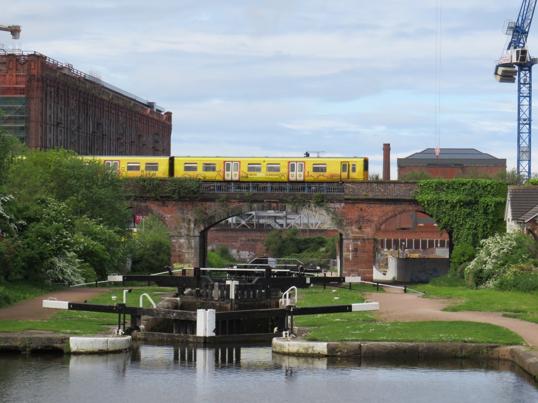 Ross McCall on Train Siding: Class 507/508 passing over the Leeds-Liverpool Canal in Vauxhall with the magnificent "Tobacco Warehouse" behind.