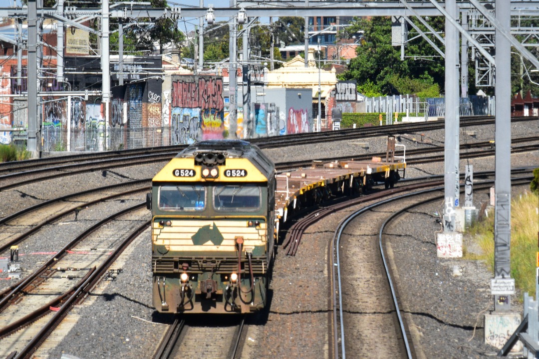 Shawn Stutsel on Train Siding: Pacific National's G524, still wearing the Freight Australia livery trundles towards Footscray, Melbourne with a wagon
transfer ex...
