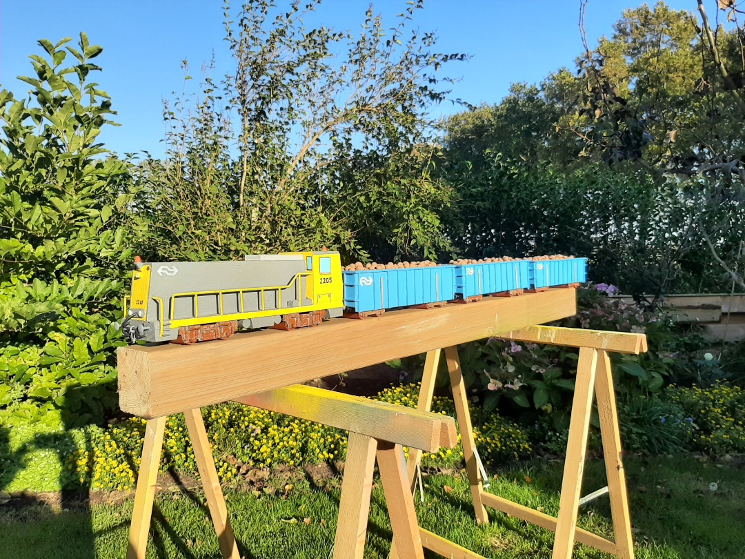 RRail on Train Siding: The loco is made of an old garden pole and some timber left overs. The fences are made of old iron bits and pieces. The waggons are made
of some...