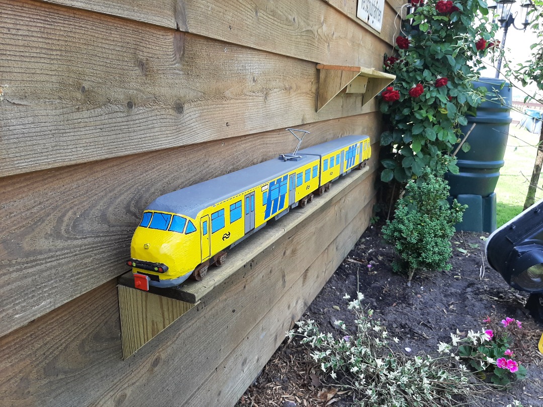 RRail on Train Siding: And another train made out of scrapwood. It measures 125 centimeters. Again the wheels are made of broom stick the train itself is made
out of...