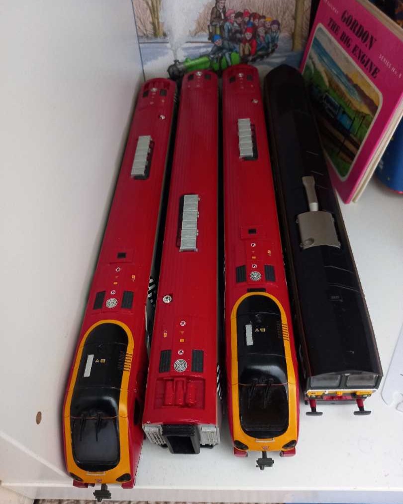 Ben on Train Siding: Here is a couple of photos of all of my model train/rolling stock shelves: 1. This is the top shelf with coaches and freight and things
that my...