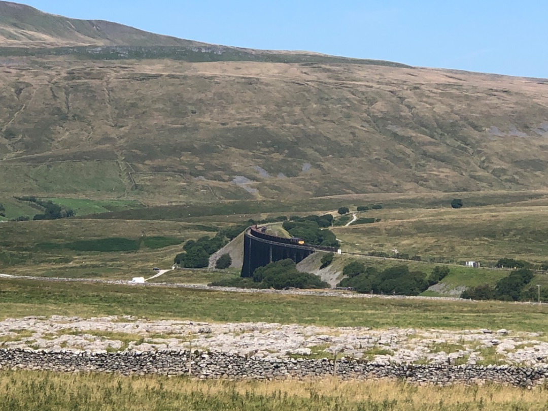 k unsworth on Train Siding: Unidentified former EWS class 66 is dwarfed by the landscape on Ribblehead Viaduct this morning, Whernside in the background.....