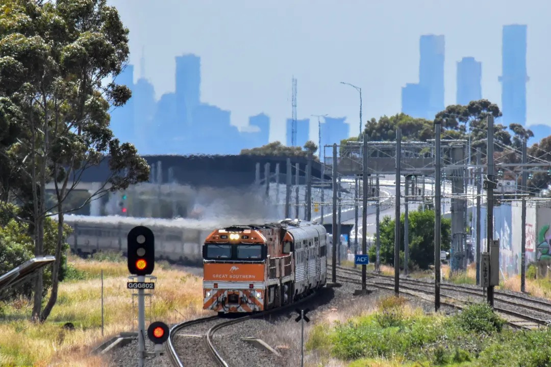Shawn Stutsel on Train Siding: The Journey Beyond's, The Great Southern Heads through Williams Landing, Melbourne heading west back to Adelaide as 2TA8,
behind NR31...