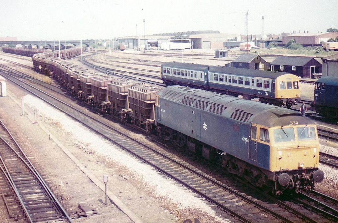 Inter City Railway Society on Train Siding: Peterborough 19th of June 1985 47374 passes by the stabling point with a southbound Fly-ash working.