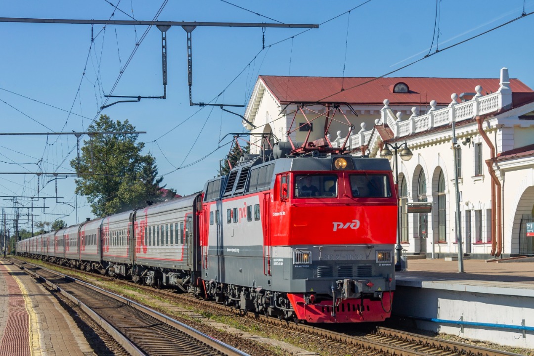 Vladislav on Train Siding: The ChS2T-1036 electric locomotive with a passenger train arrives at the Volkhovstroy-1 station to make a short stop and continue on
to...
