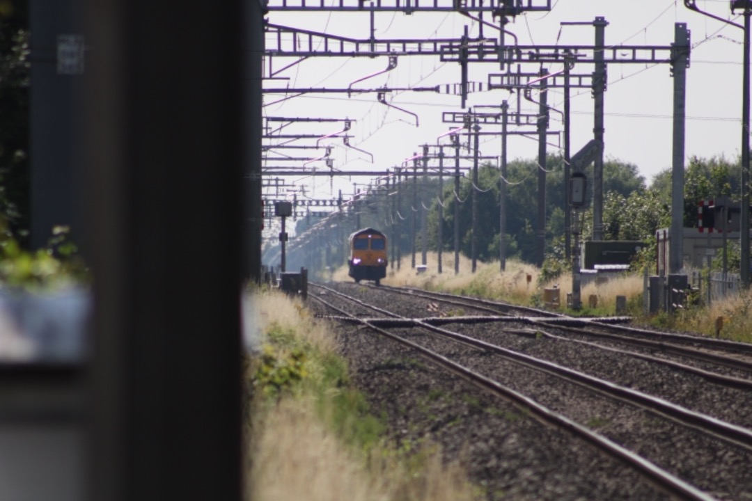 Michael W on Train Siding: GBRF class 66 'Shed' No. 66725 working light loco past Steventon LCs on 0V44 Eastleigh East Yard to Bicester MOD GBRF.
(19/07/2021).